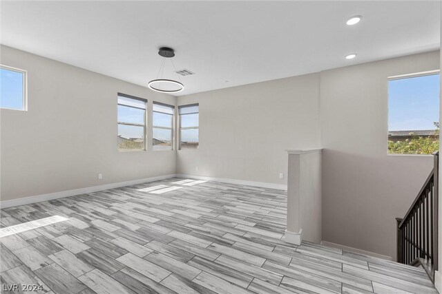 spare room featuring light hardwood / wood-style floors