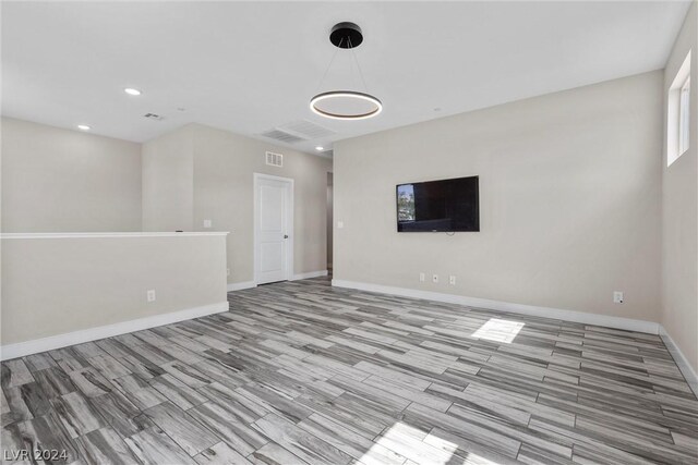 unfurnished living room with light hardwood / wood-style floors