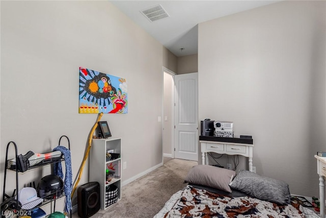 bedroom with baseboards, visible vents, and light colored carpet