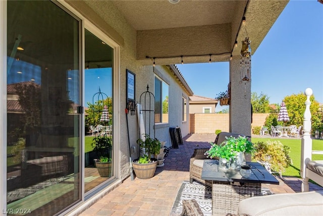 view of patio featuring fence