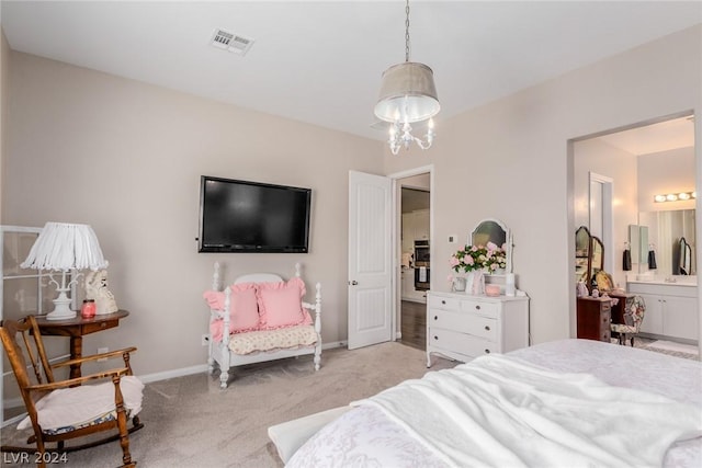 bedroom with light colored carpet, visible vents, baseboards, ensuite bath, and an inviting chandelier