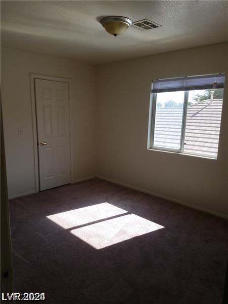 unfurnished room with carpet floors