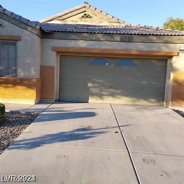 garage with driveway