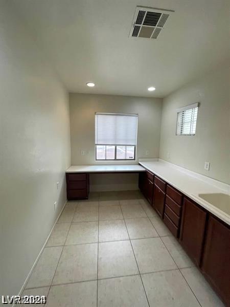 bathroom featuring tile patterned floors, recessed lighting, visible vents, and a sink