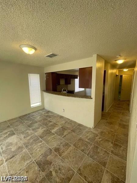 interior space featuring a textured ceiling