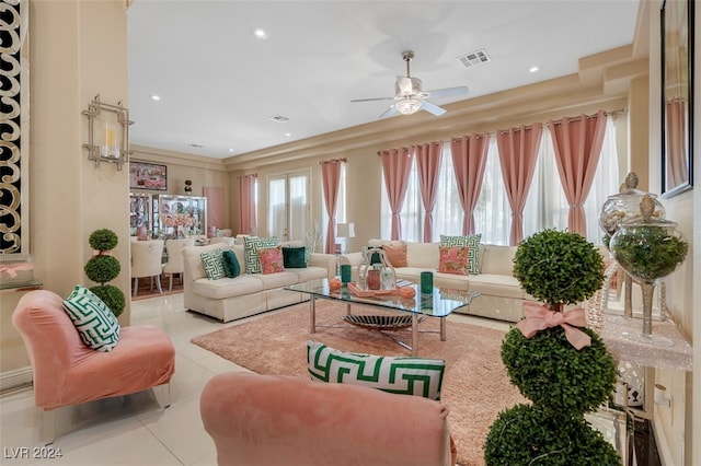 tiled living room featuring ceiling fan and a healthy amount of sunlight