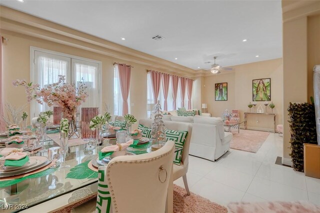 dining room with light tile patterned floors and ceiling fan