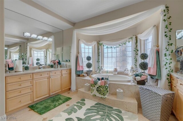 bathroom featuring vanity, a wealth of natural light, and tile patterned floors