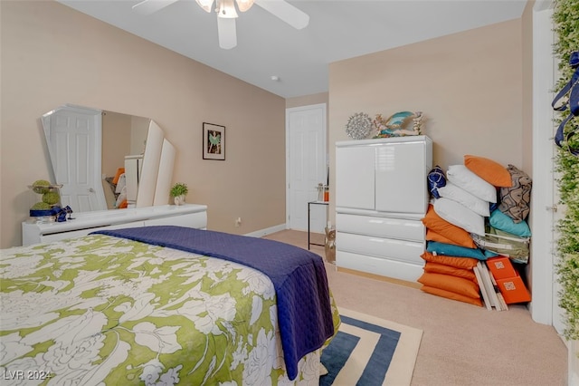 bedroom with ceiling fan and carpet