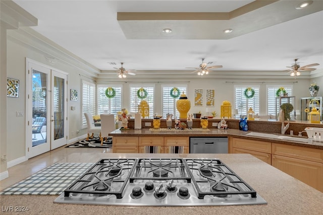 kitchen featuring sink, light tile patterned floors, stainless steel appliances, light brown cabinetry, and french doors