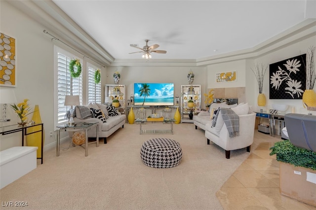 living room with ceiling fan, ornamental molding, and light tile patterned floors