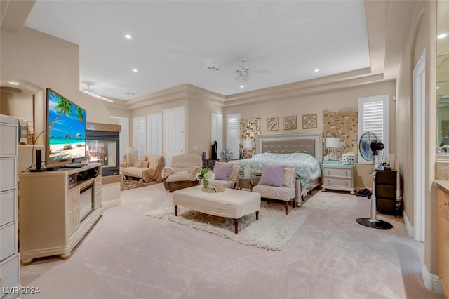 bedroom featuring light carpet and ceiling fan