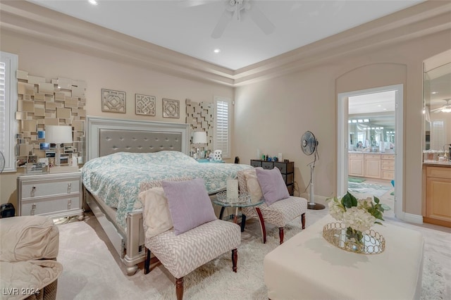 bedroom featuring ceiling fan and connected bathroom