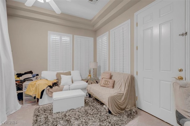 sitting room featuring ceiling fan