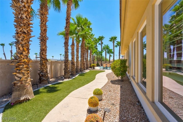 view of yard with a fenced in pool and a patio area