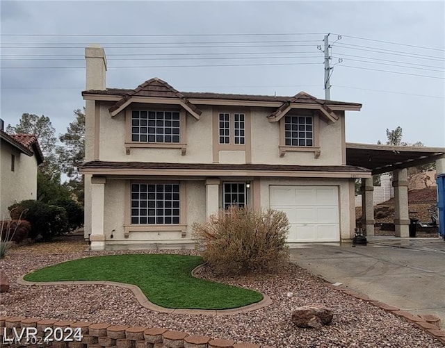 traditional-style house with a chimney, a garage, driveway, and stucco siding