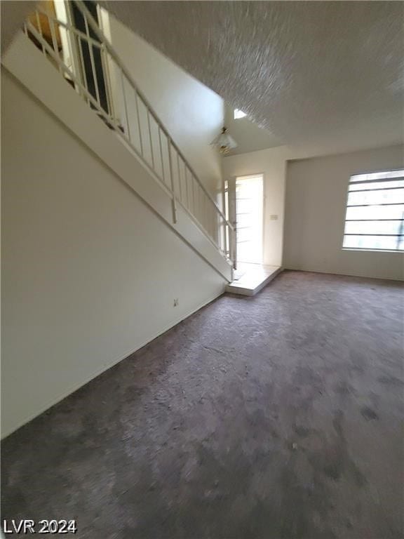 interior space featuring concrete flooring and a wealth of natural light