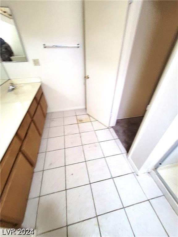 bathroom featuring vanity and tile patterned flooring