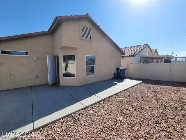 rear view of house featuring a patio