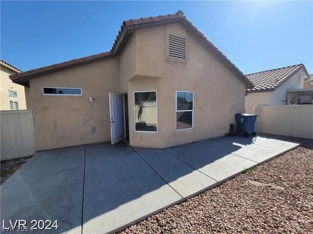 rear view of house featuring a patio area