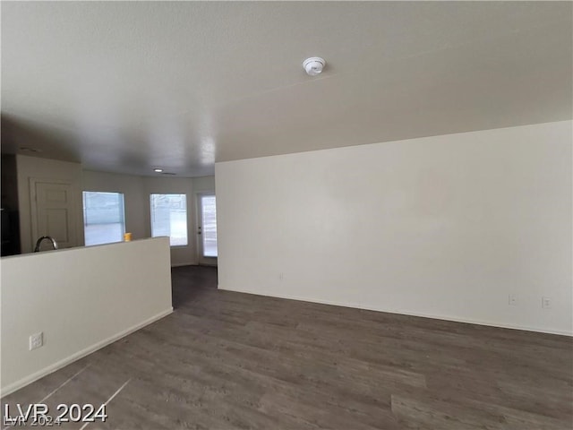 unfurnished room featuring dark hardwood / wood-style floors