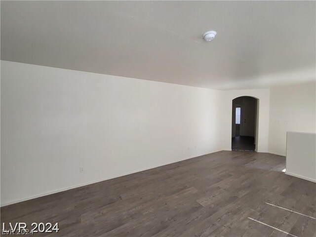 unfurnished room with wood-type flooring