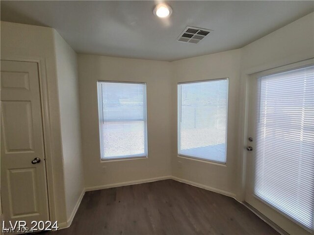 spare room with wood-type flooring