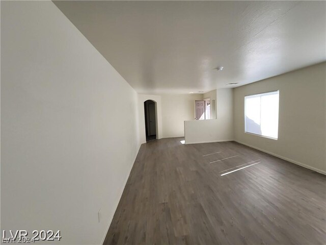 spare room featuring wood-type flooring