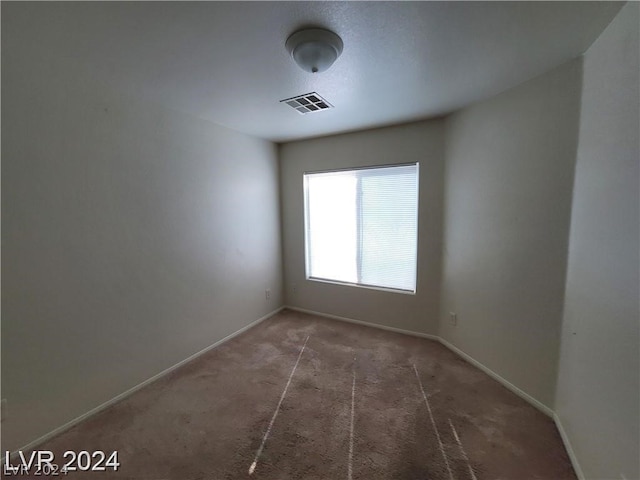 spare room featuring carpet flooring