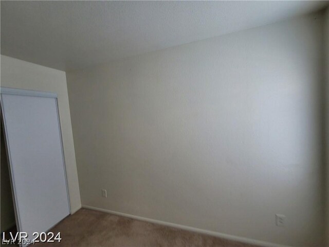 empty room featuring carpet flooring