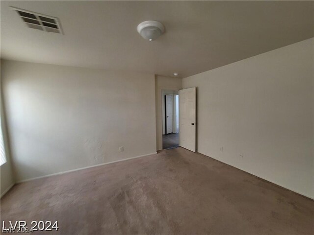 empty room with carpet flooring