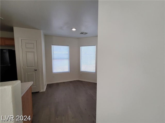 hall with dark wood-type flooring