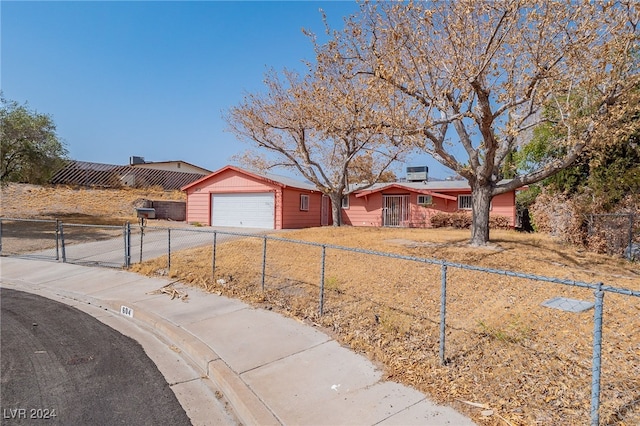 single story home featuring a garage