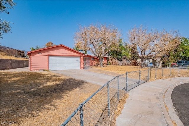 exterior space with an outdoor structure and a garage