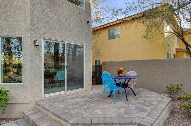 view of patio featuring fence