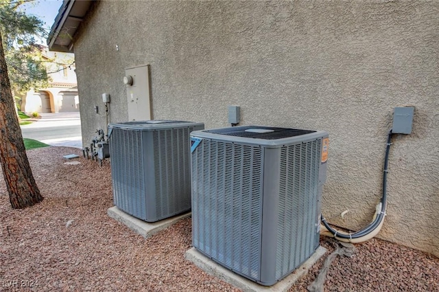 details with stucco siding and cooling unit