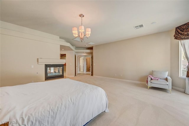 carpeted bedroom with an inviting chandelier and a multi sided fireplace