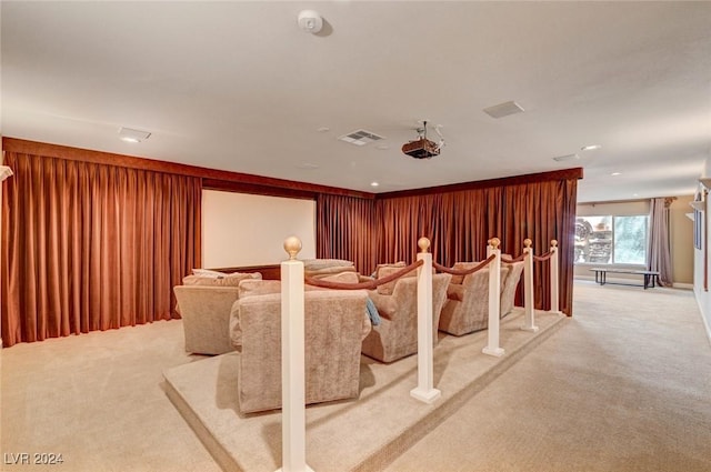 cinema room featuring light colored carpet and visible vents