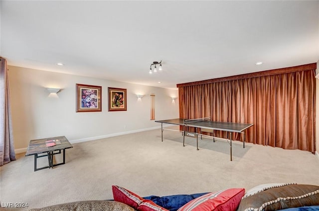 game room featuring light colored carpet