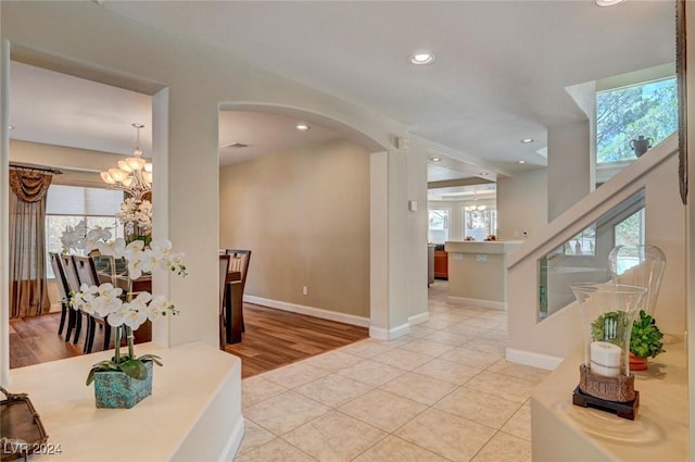 interior space with an inviting chandelier and a healthy amount of sunlight