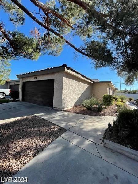 view of side of home with a garage