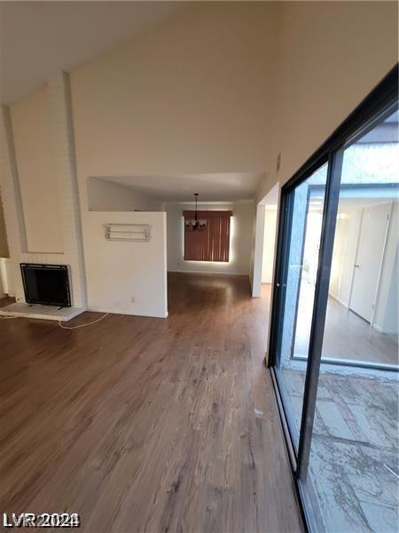 unfurnished living room featuring hardwood / wood-style flooring and a fireplace