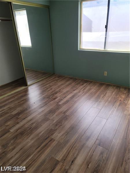 spare room featuring hardwood / wood-style floors