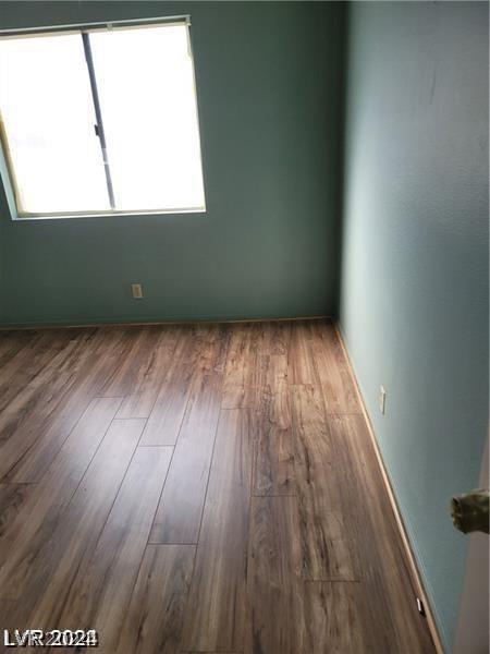 empty room featuring hardwood / wood-style flooring