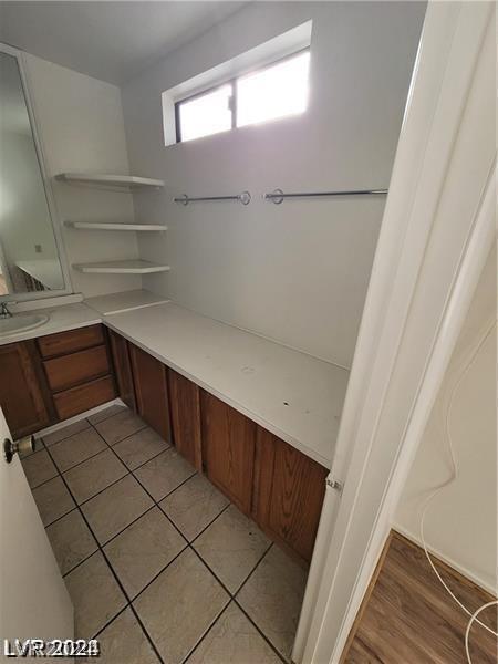 bathroom featuring vanity and wood-type flooring