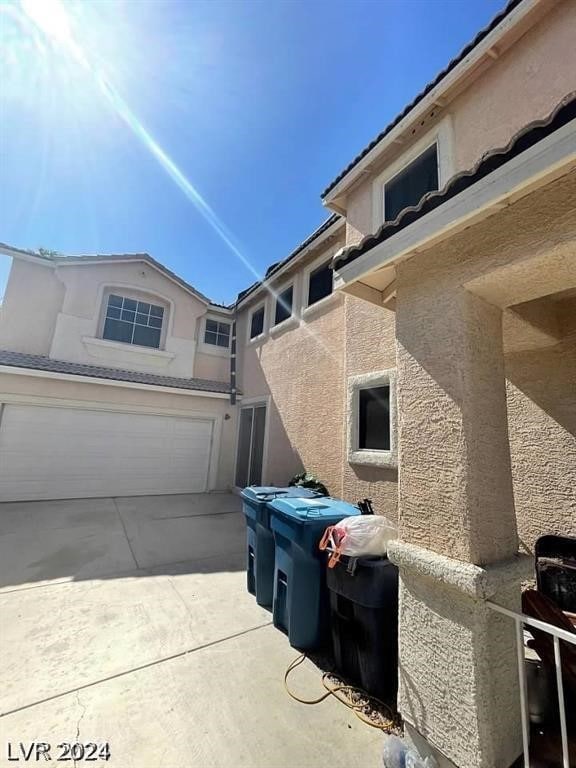 view of side of property featuring a garage