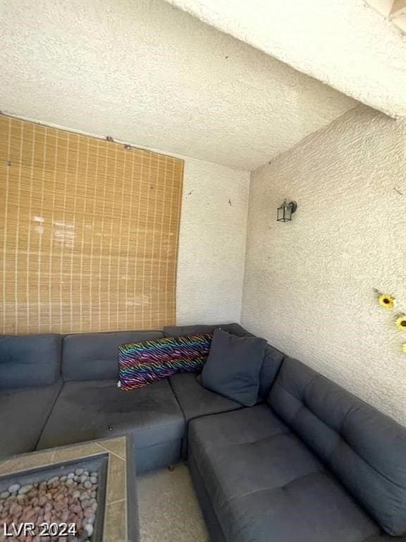 living room with carpet floors and a textured ceiling