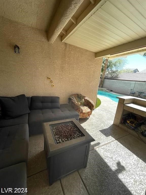 view of patio / terrace with an outdoor fire pit