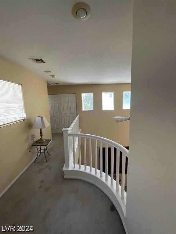 stairway featuring concrete floors