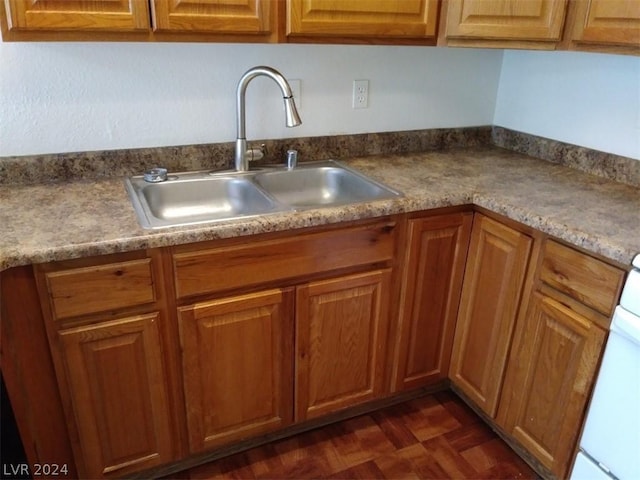 1501 Linnbaker Ln Unit 103, Las Vegas, NV 89110 - kitchen with a sink and brown cabinets